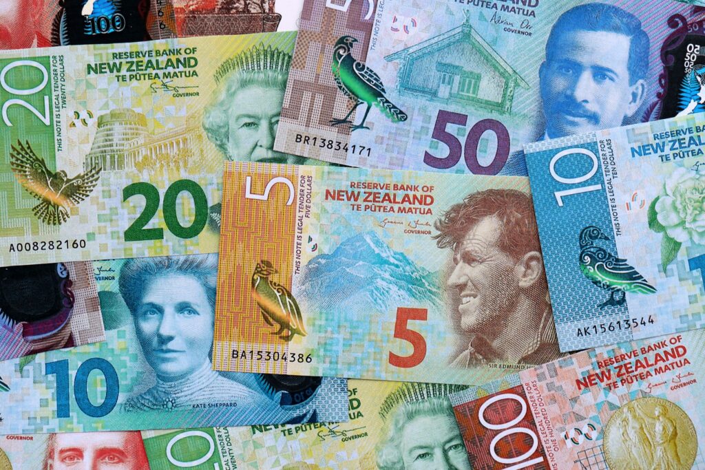 New Zealand dollar money bills in big amount on table close up. Rich life concept in New Zealand. Business and economy